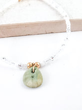Load image into Gallery viewer, Glass bead bracelet with a green stone pendant
